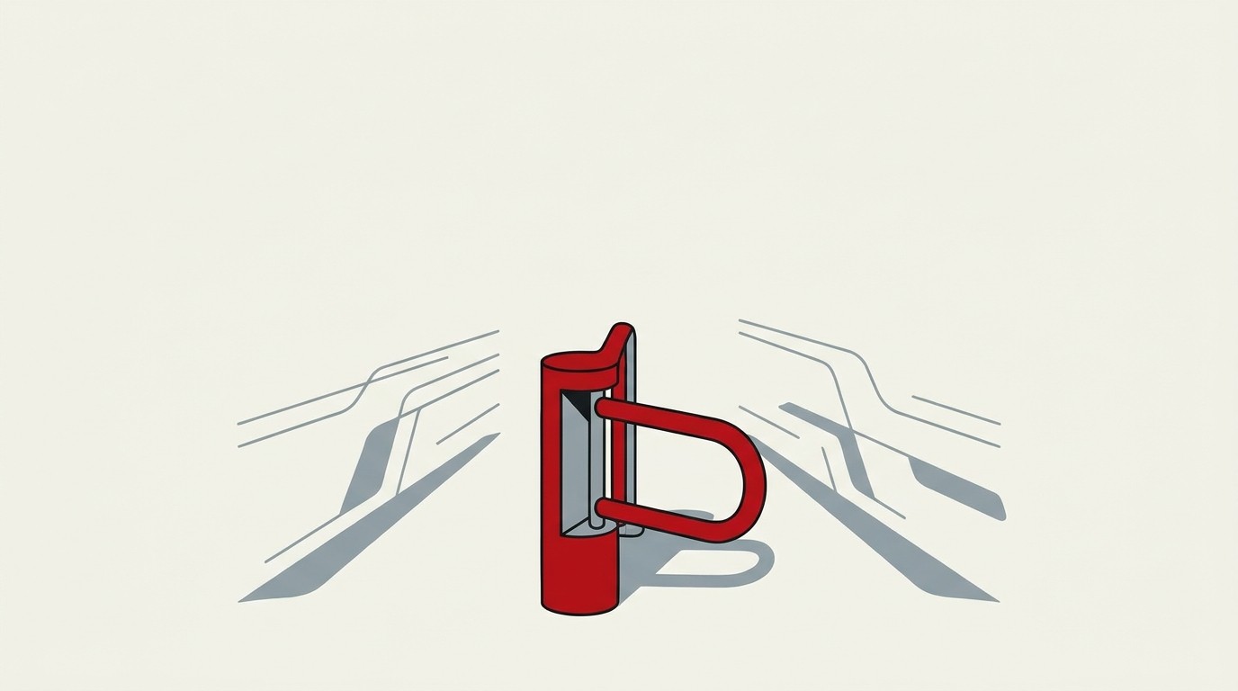 A cream field with a single red gate closing across a path, doors open behind it