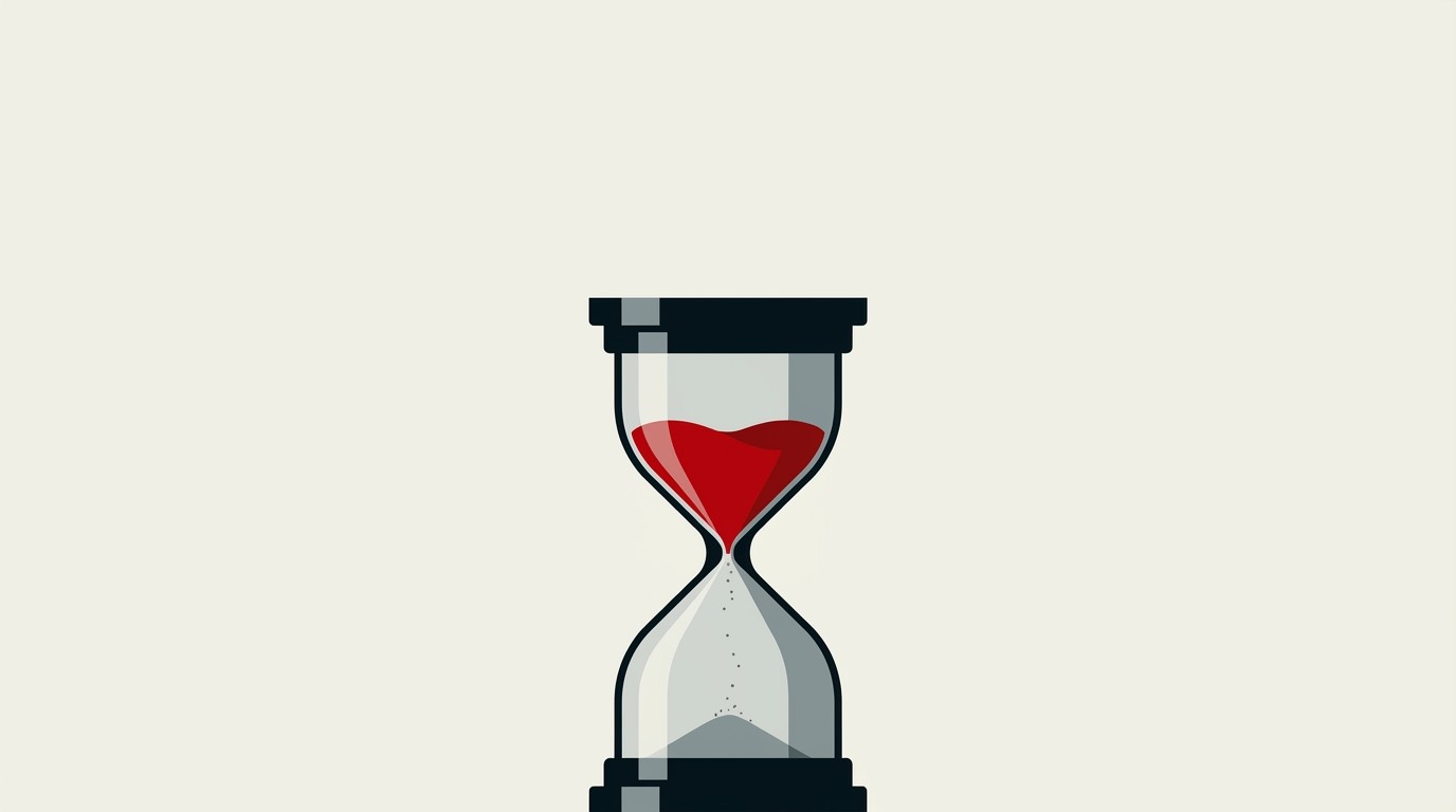 A single red hourglass with sand stopped mid-fall, sitting on a cream background under empty space